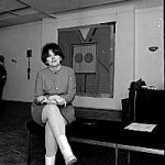 Joyce Wieland seated in the Isaacs Gallery, 1967.