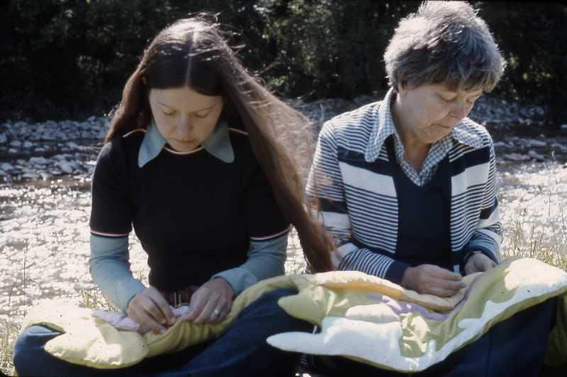 Two assistants assemble Joyce Wieland's quilt, 1977