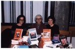 Julie Murray, Barbara Godard and Jennifer Henderson posing with TESSERA series at the LeftWord Book Fair, October 2001. From Tessera fonds, image number ASC07028.