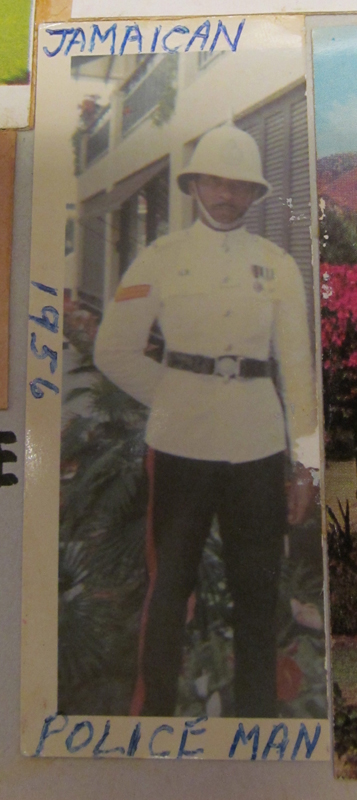 A cropped photograph of a Jamaican police officer in uniform. Annotated around the image reads "Jamaican Police Man 1956."