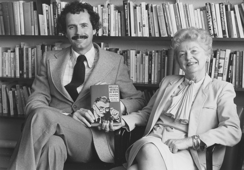 Image of Clara Thomas and John Lennox holding a copy of William Arthur Deacon: a Canadian literary life,1982 Clara Thomas fonds, F0432, image no. ASC00504.