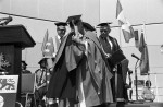 Image of Prof. Clara Thomas (left) is embraced by honorary degree recipient, author Margaret Laurence (right), June 1980. Computing & Network Services fonds, F0477, image no. ASC04594.
